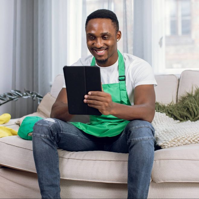 african-male-cleaner-using-digital-tablet-while-re-2021-12-09-06-24-50-utc-e1662002044319.jpg